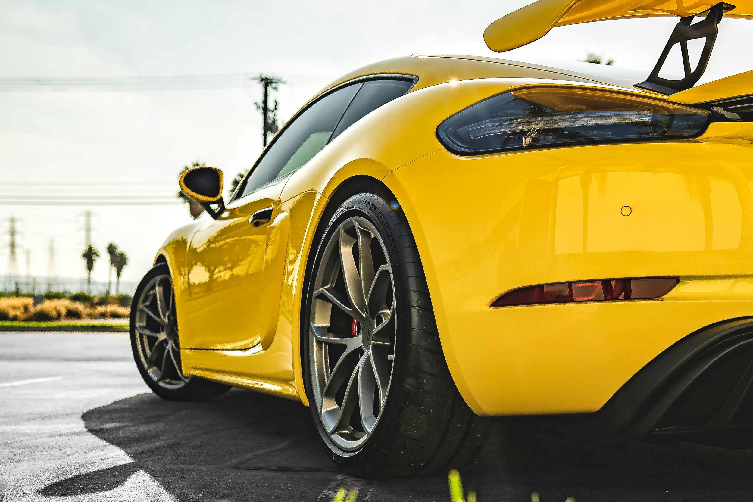 2021 yellow porsche gt4 rear shot after paint correction, paint protection film [clear bra], ceramic coating & tint in oc, ca