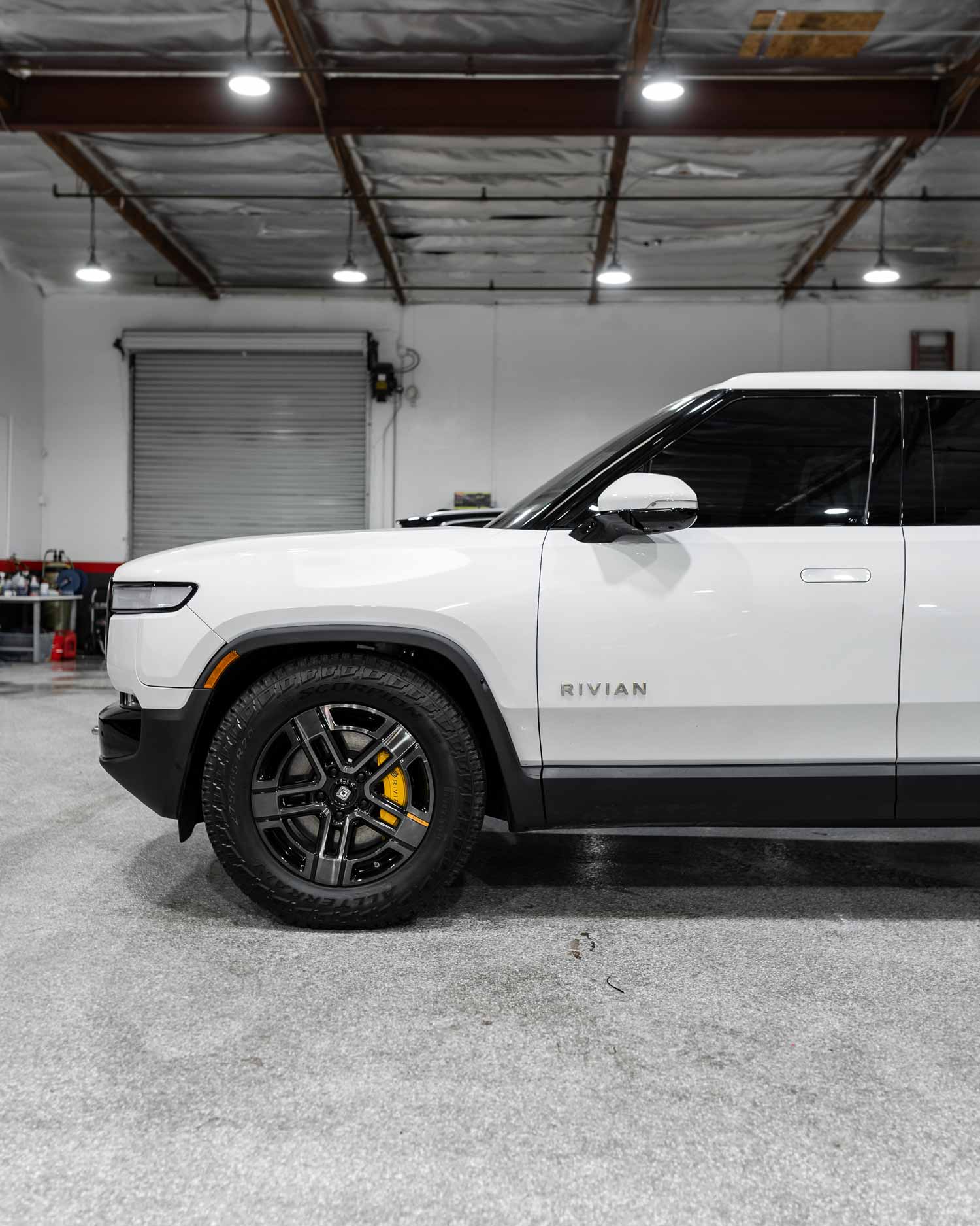 2022-white-rivian-rt1-side-view-after-tint