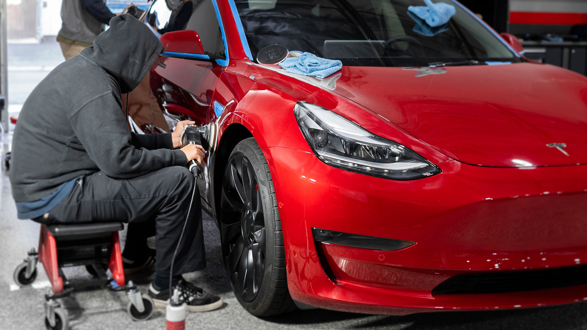 red-tesla-model-3-polishing