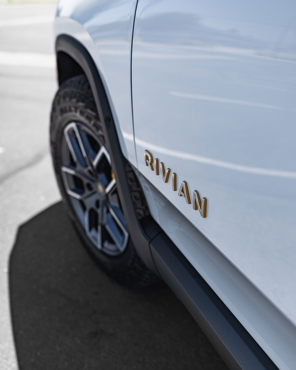 White-Rivian-R1T-side-emblem-SFW-